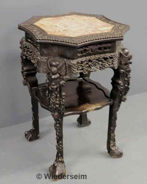 Appraisal: Carved ebonized Asian plant stand with marble insert top As