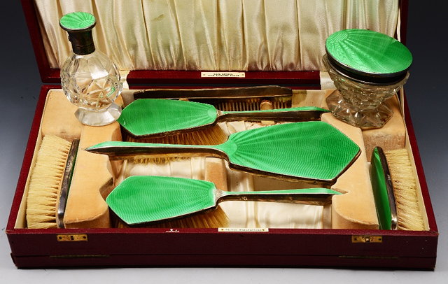 Appraisal: A CASED SILVER AND ENAMEL VANITY SET CONSISTING OF two