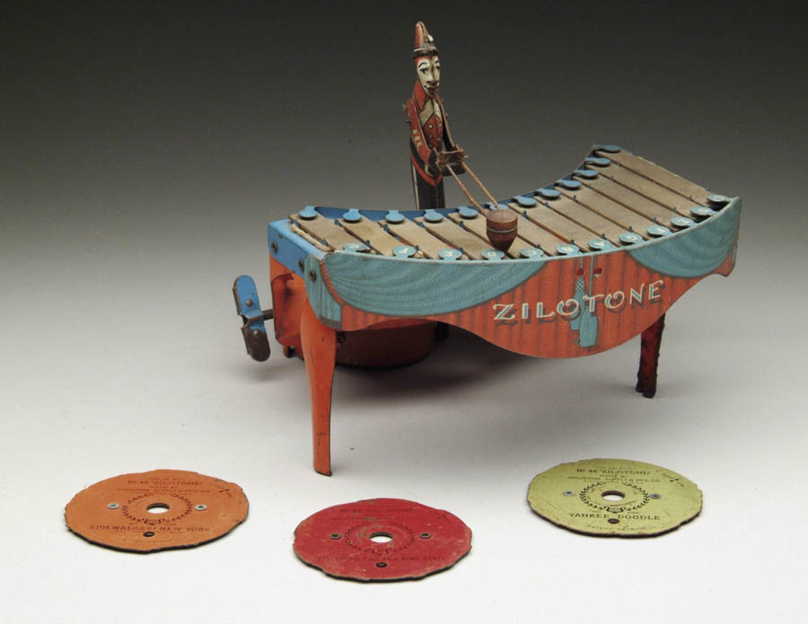 Appraisal: A WOLVERINE ZILOTONE PLAYER Player stands behind zilotone with a