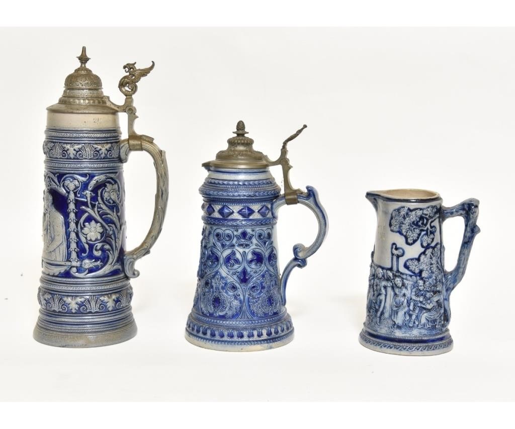 Appraisal: Two German stoneware steins together with a pitcher Tallest h