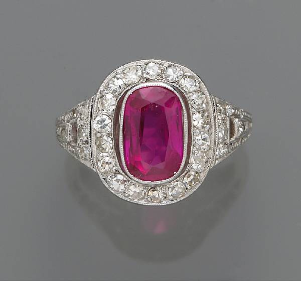 Appraisal: A ruby and diamond ring centering an oval-shaped ruby mounted