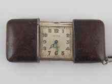 Appraisal: A silver Movado travelling watch with leather covered sides circa