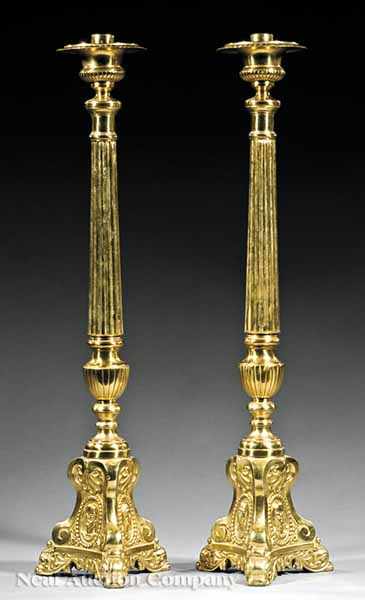 Appraisal: A Pair of Gilt Brass Ecclesiastical Candlesticks c fluted columnar