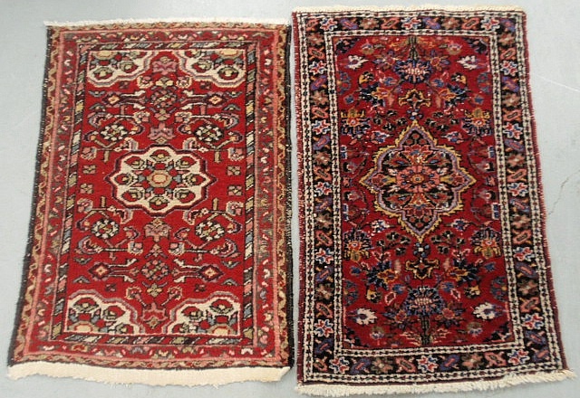 Appraisal: - Two similar Persian oriental mats with red fields and