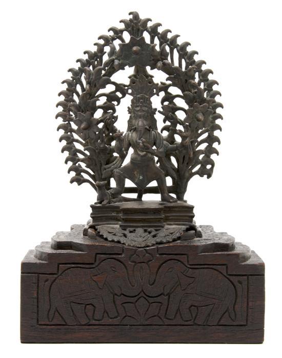 Appraisal: An Indian Bronze Figure of Ganesha depicted inside of a