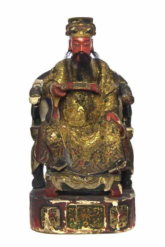 Appraisal: A Chinese Temple Carving depicting a seated ruler having a