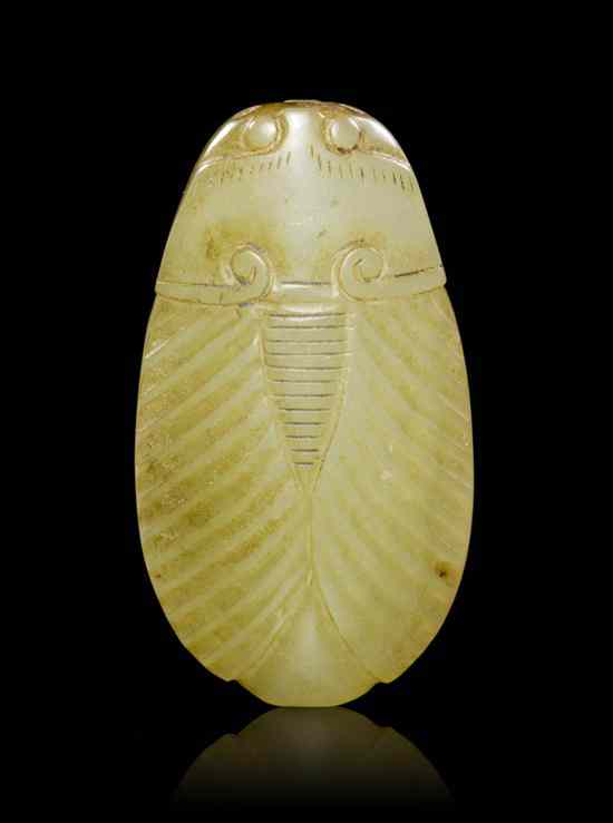 Appraisal: A Chinese Carved White Nephrite Jade Cicada of pebble form