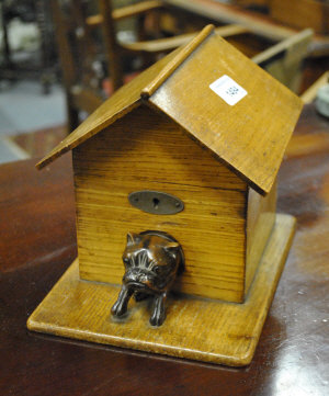 Appraisal: A cigar box in the form of a dog's kennel