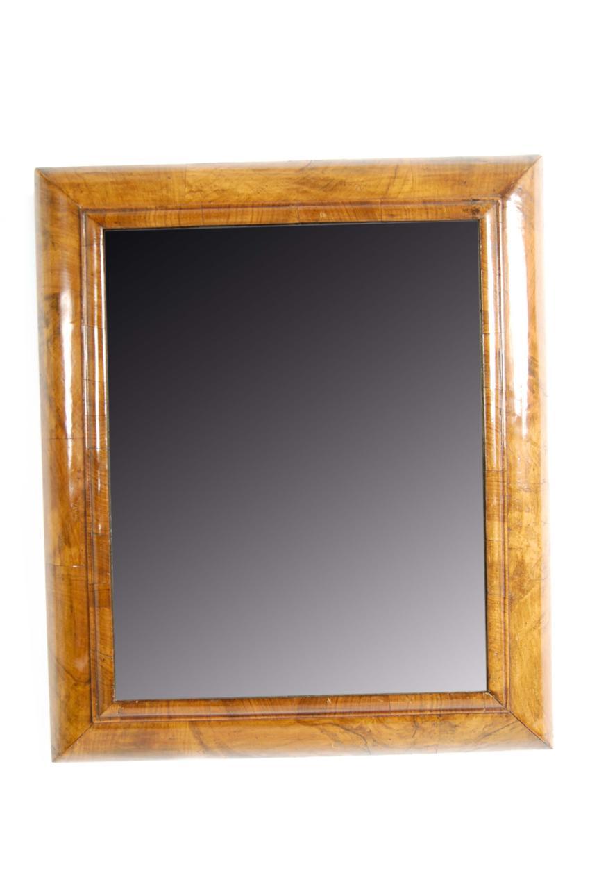 Appraisal: A William and Mary walnut cushion frame mirror