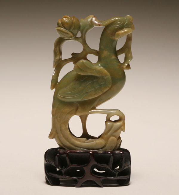 Appraisal: Chinese early th century carved jade phoenix presented with a