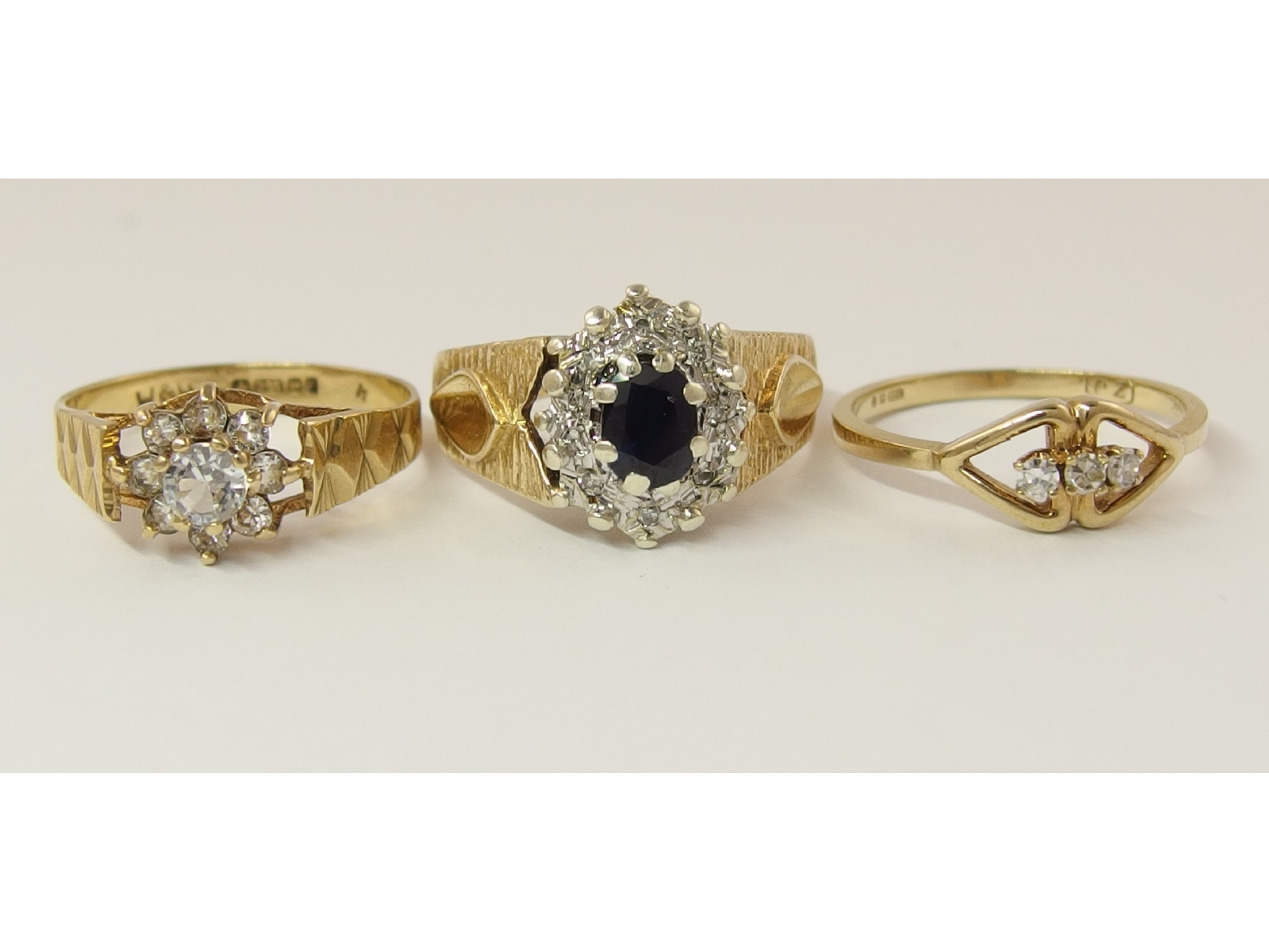 Appraisal: Three retro ringsa ct sapphire and diamond retro ring finger