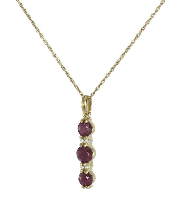 Appraisal: K GOLD DIAMOND AND RUBY PENDANT NECKLACE K yellow gold