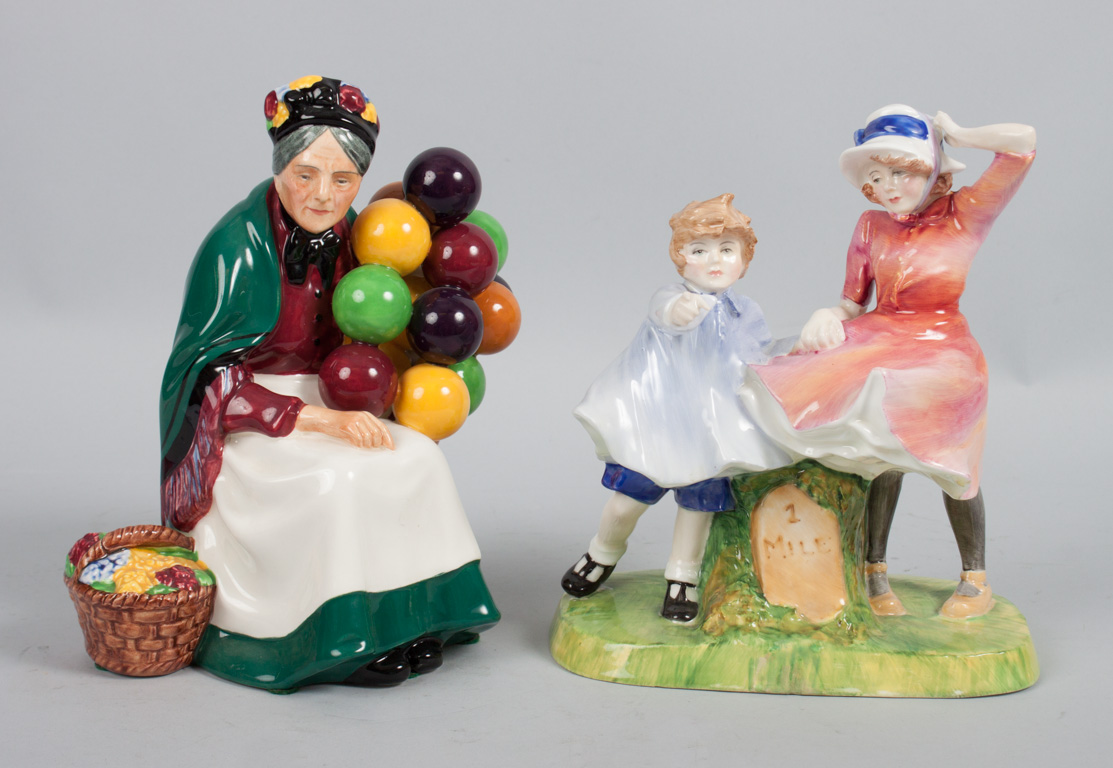 Appraisal: Two Royal Doulton china figures The Old Balloon Seller HN