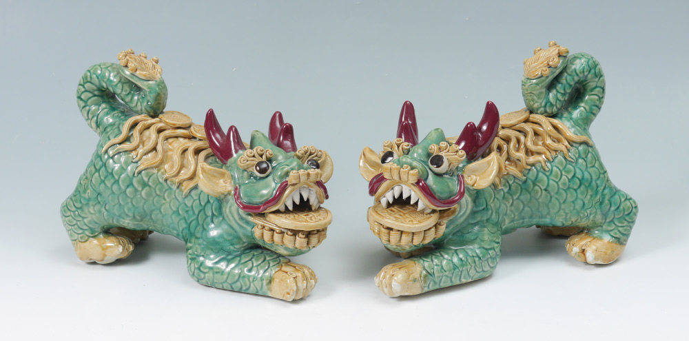 Appraisal: PAIR GLAZED CERAMIC FOO DRAGONS Green glazed bodies with ceramic