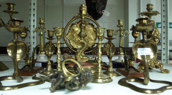 Appraisal: A brass table gong on a black stone plinth and