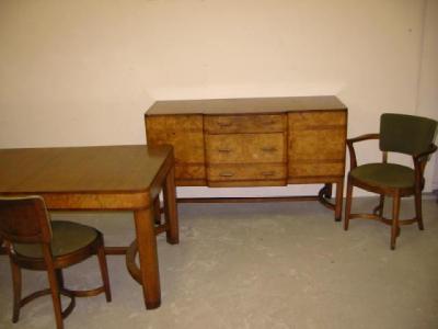 Appraisal: AN ART DECO WALNUT DINING SUITE with rosewood crossbanding and