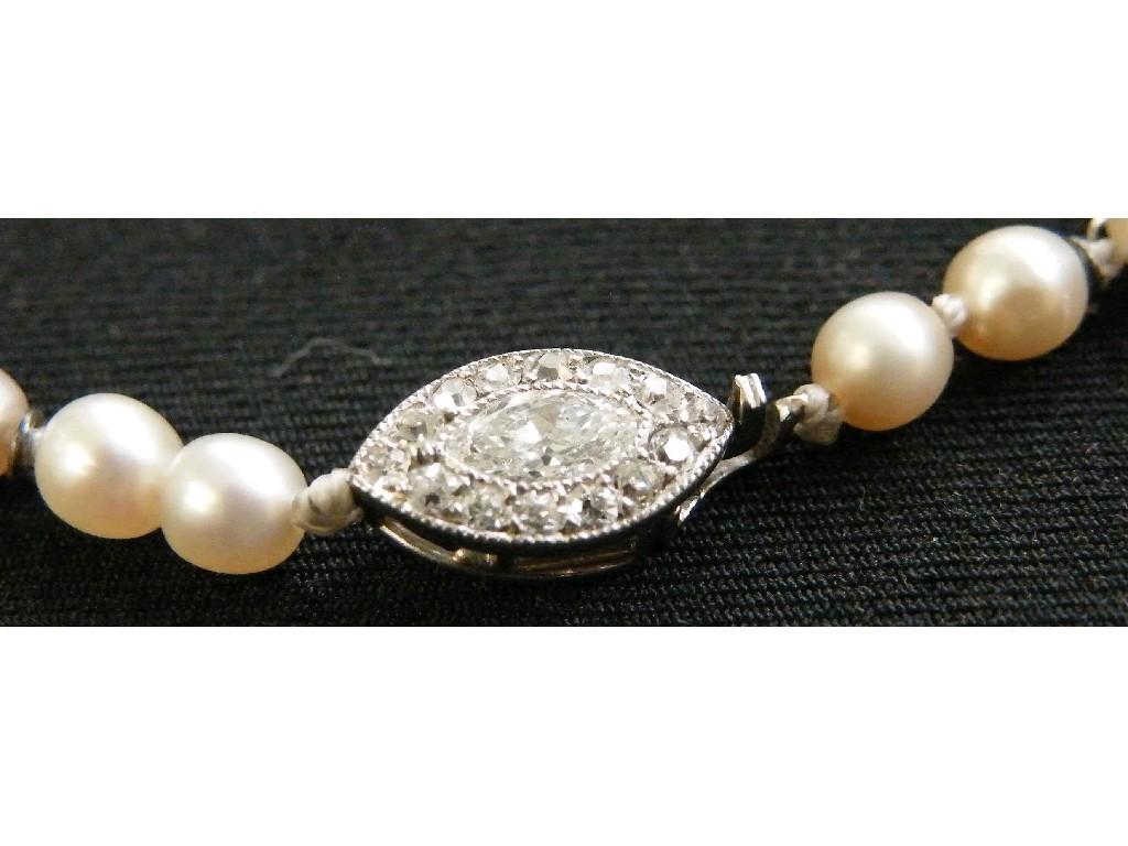 Appraisal: s graduated pearl single row necklet with a platinum marquise