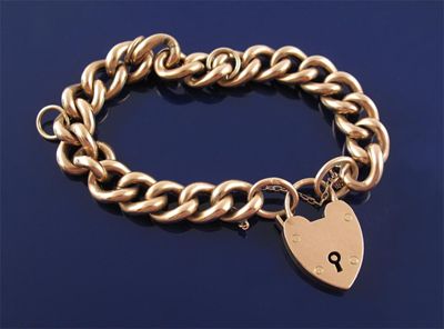 Appraisal: A ct gold curb link bracelet with ct gold padlock