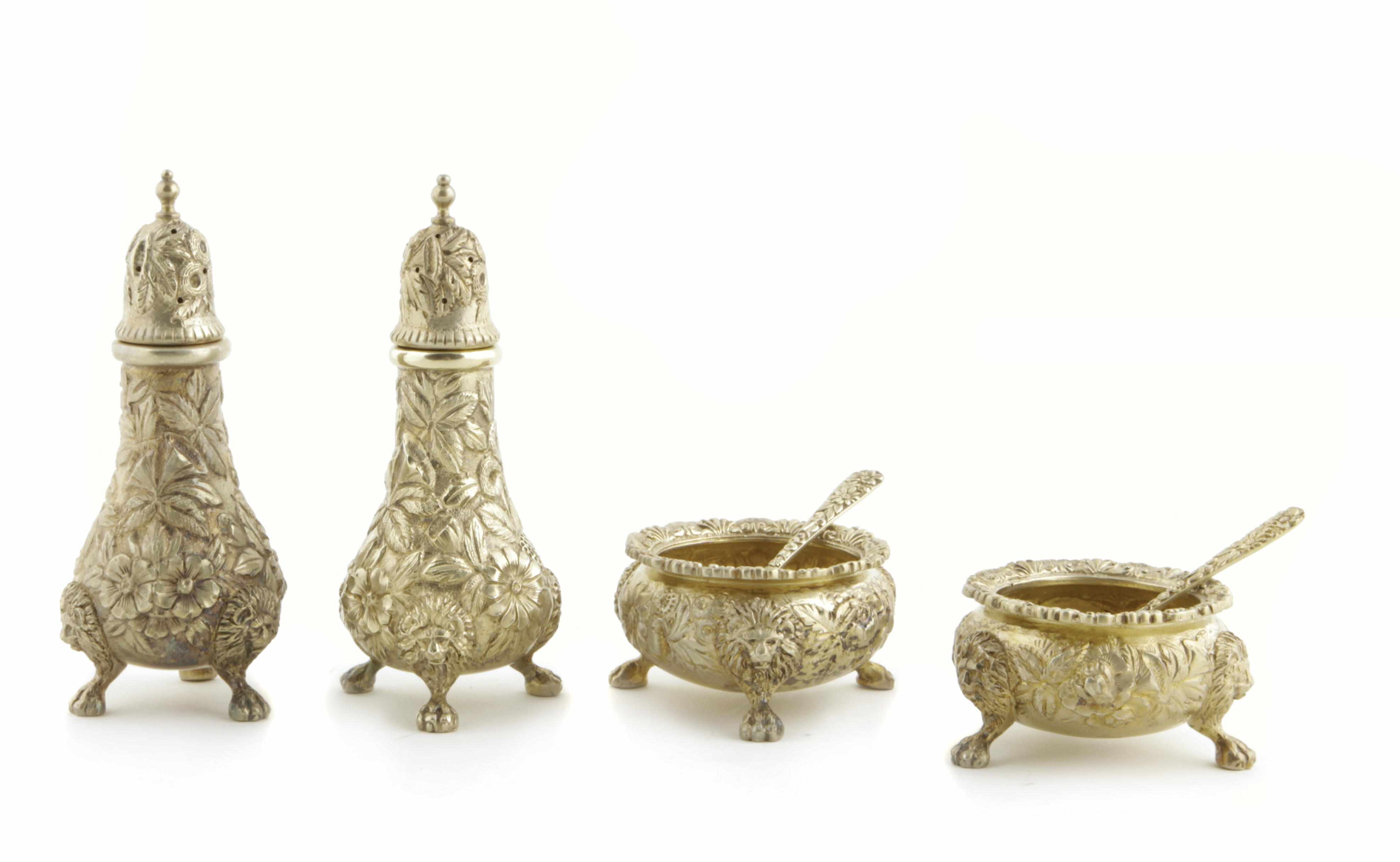 Appraisal: A sterling-gilt floral chased condiment set for eighteen S Kirk