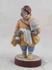 Appraisal: A Russian ceramic Gardner figure of a street vendor Impressed