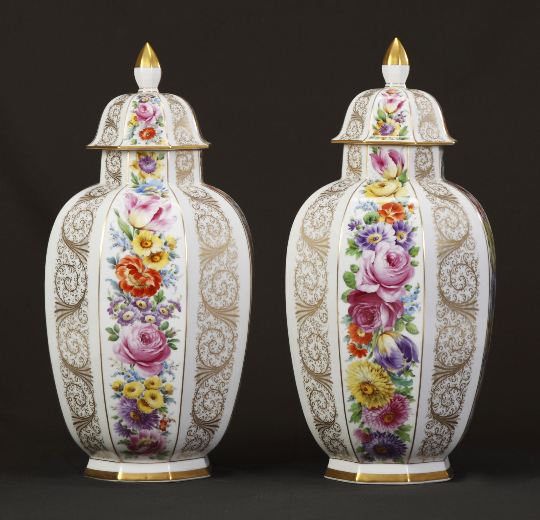 Appraisal: Dresden Covered Urns Hand painted flowers gold leaf highlights Condition