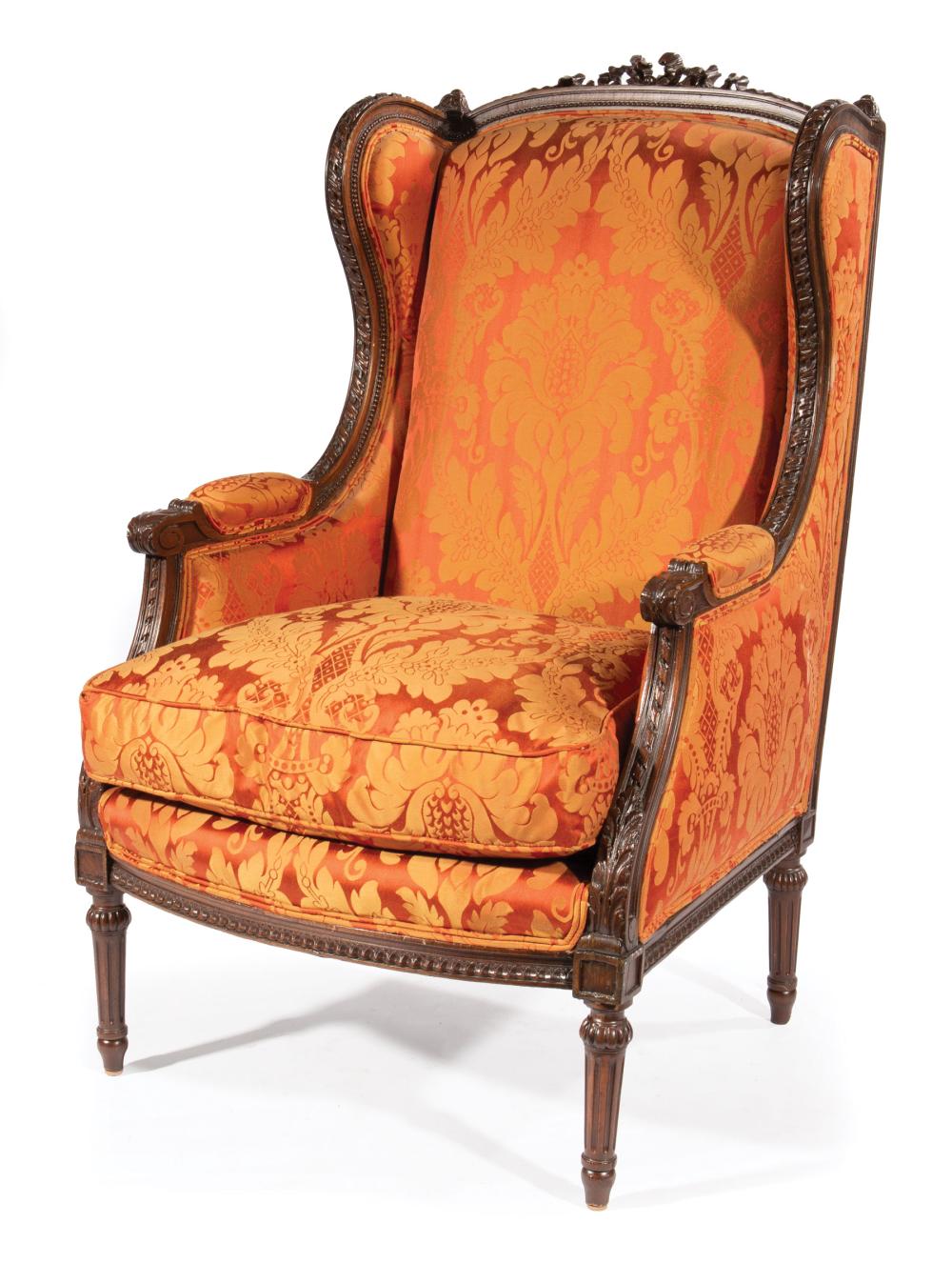 Appraisal: Louis XVI-Style Carved Mahogany Bergere a Oreilles bowknot crest padded