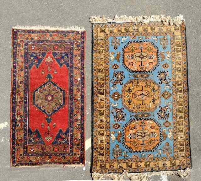 Appraisal: A PERSIAN MISHKIN RUG with geometric motifs on a pale