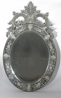 Appraisal: A Murano glass wall mirror elliptical form with floral mantle