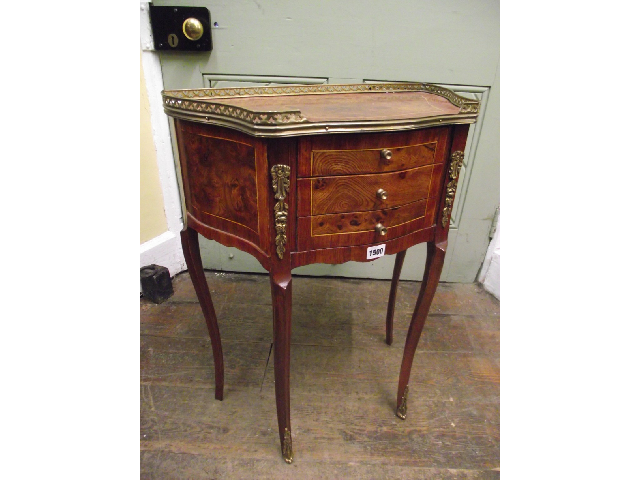 Appraisal: A continental side table in mixed woods enclosing three frieze