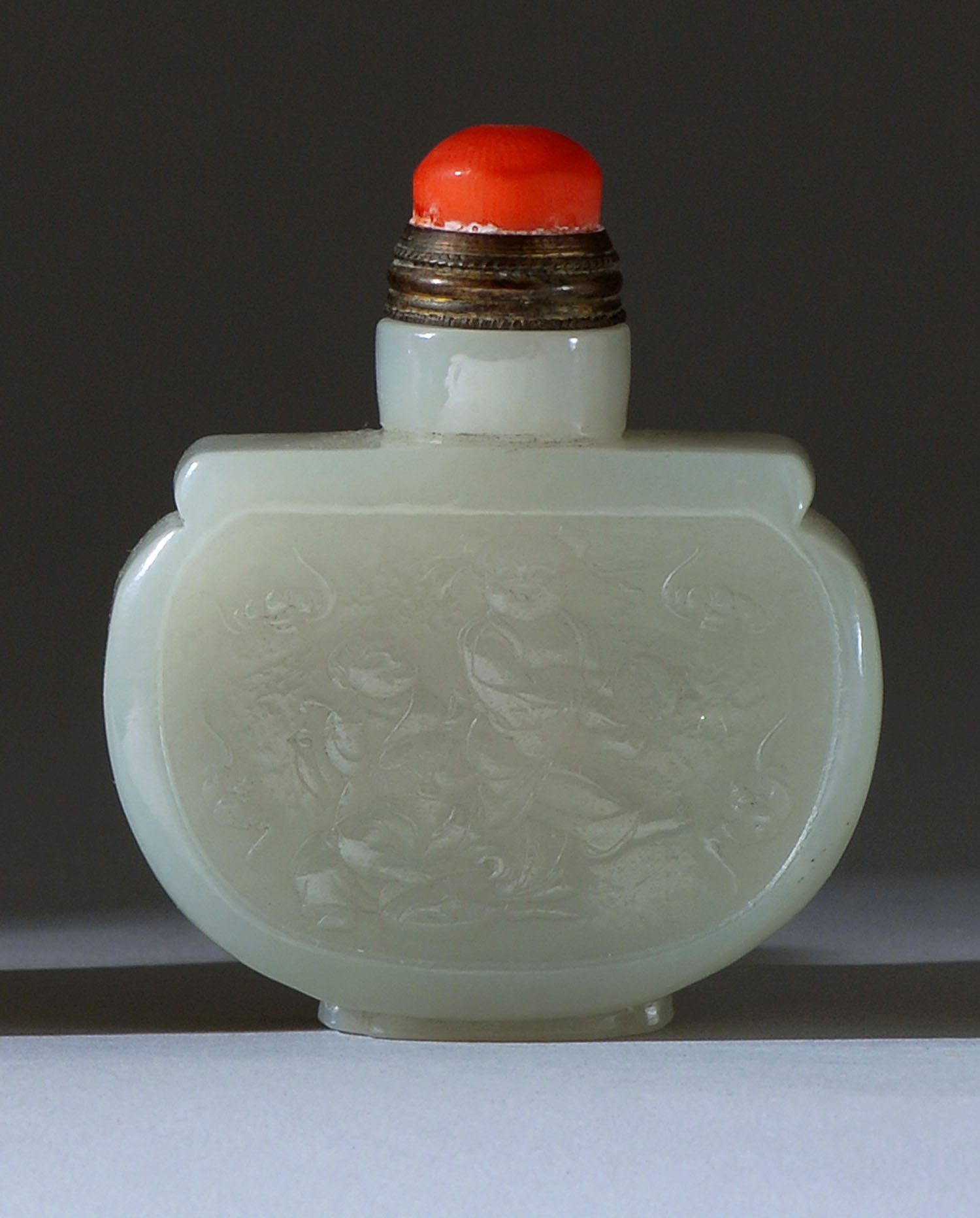 Appraisal: WHITE JADE SNUFF BOTTLE In purse form With relief carving