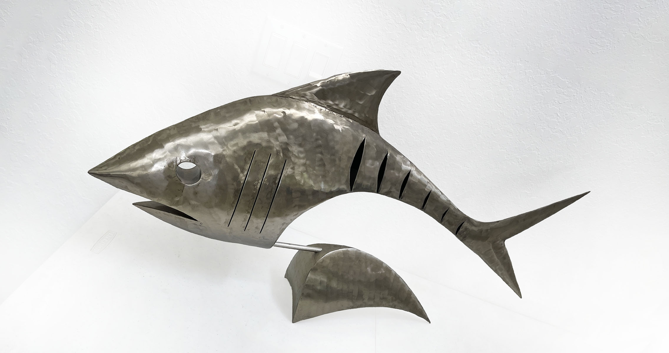 Appraisal: LARGE STAINLESS STEEL FOSSIL FISH BY STUART PETERMAN ''h X