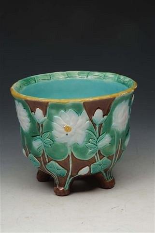 Appraisal: A HOLDCROFT MAJOLICA JARDINIERE with white lily flower and lily