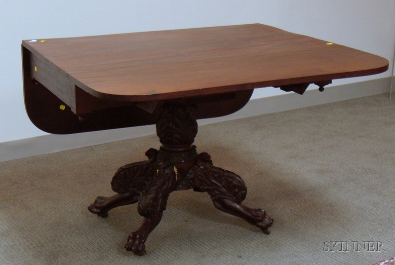 Appraisal: Classical Carved Mahogany and Mahogany Veneer Drop-leaf Pedestal-base Table with