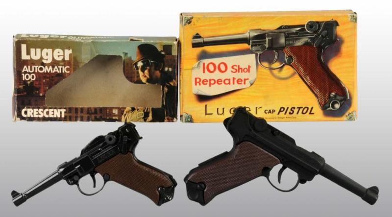 Appraisal: Lot of Luger-Style Toy Cap Guns Description Includes original boxes