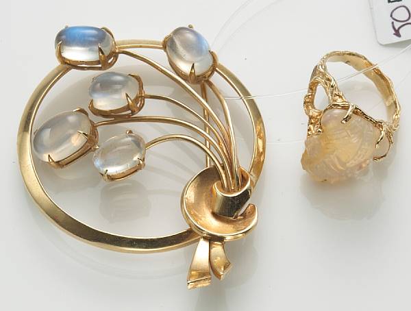 Appraisal: A moonstone and k gold brooch together with an opal