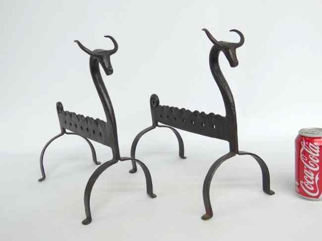 Appraisal: Pair folky blacksmith made Etruscan motif andirons '' Ht ''