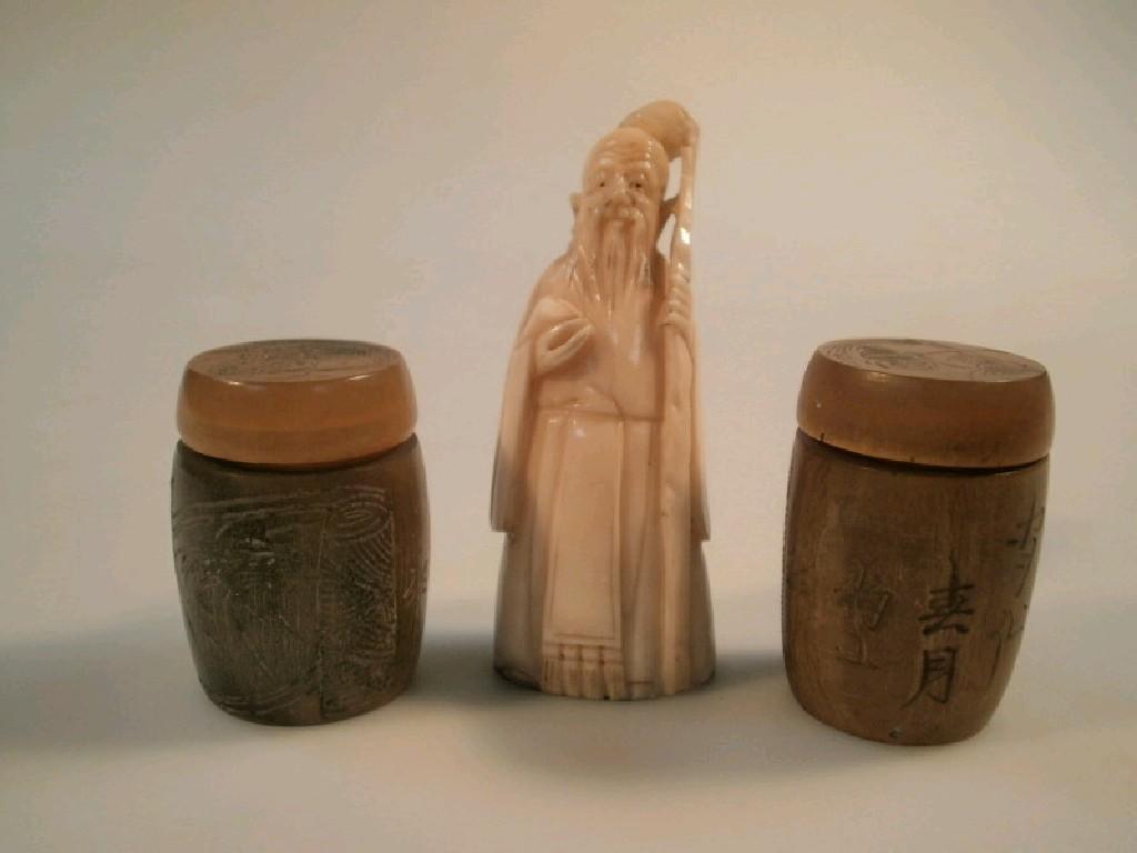 Appraisal: A pair of Chinese carved horn pots with covers and