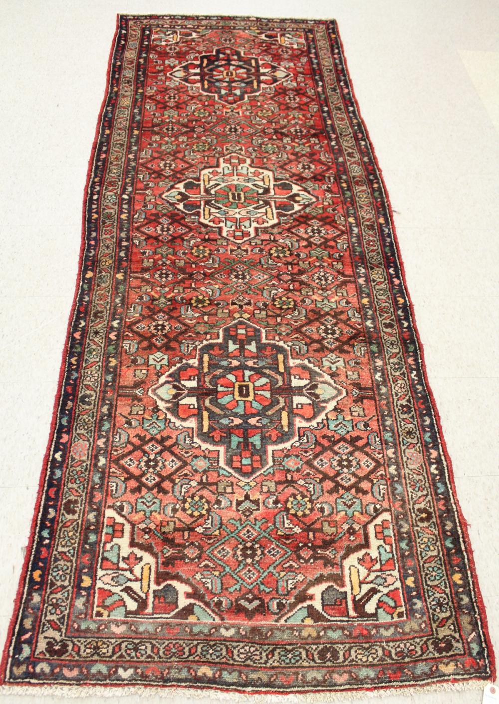 Appraisal: HAND KNOTTED PERSIAN TRIBAL AREA RUG triple geometric medallion and