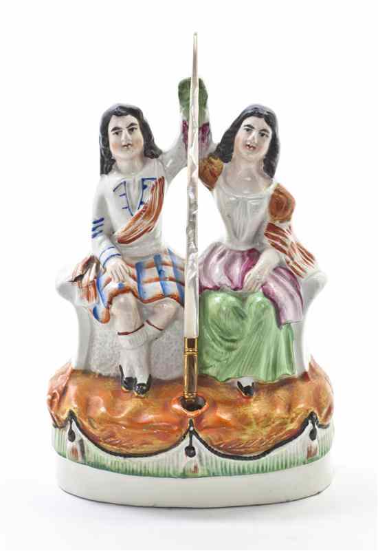 Appraisal: A Staffordshire Inkwell depicting a seated couple in polychrome decorated