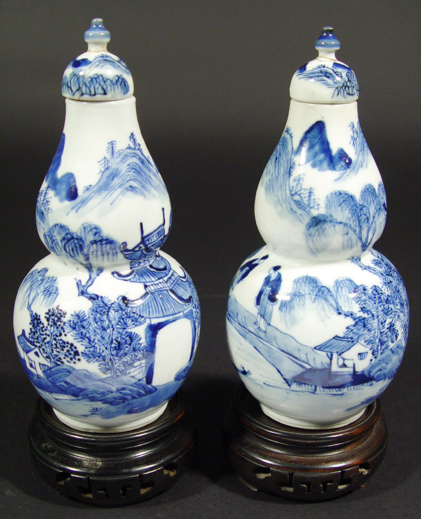 Appraisal: Pair of Oriental porcelain double gourd vases and covers each