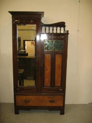 Appraisal: A WALNUT WARDROBE in the Arts Crafts style with moulded