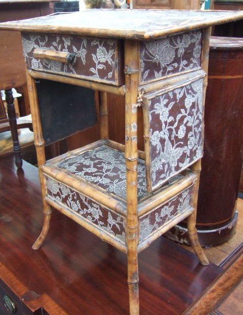 Appraisal: A Victorian bamboo two tier side table with floral decoration