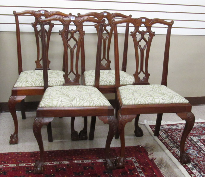 Appraisal: A SET OF FOUR MAHOGANY DINING CHAIRS Chippendale Revival style