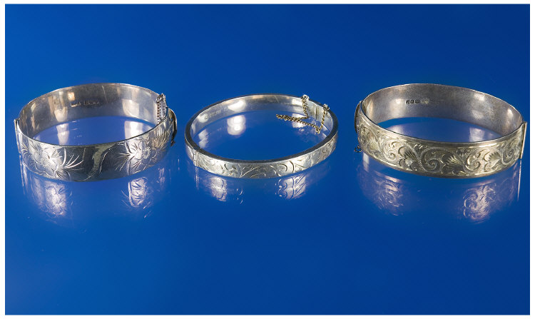 Appraisal: Three Silver Hinged Bangles The Fronts All Florally Engraved Two