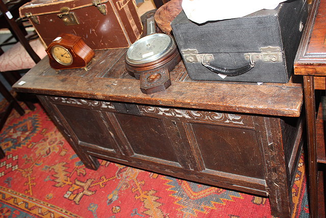 Appraisal: AN ANTIQUE OAK COFFER with triple panelled lid and triple