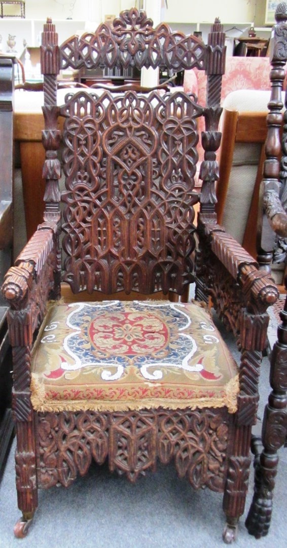 Appraisal: A th century profusely carved oak throne chair with tapestry