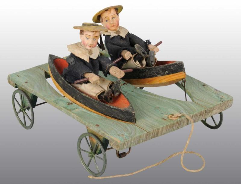 Appraisal: Pull Toy with Two Boys in Boats Description Two rowing