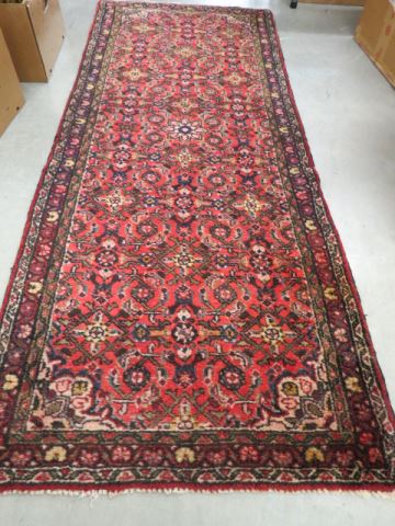 Appraisal: Sarouk Persian Handmade Rug overall floral on red field '