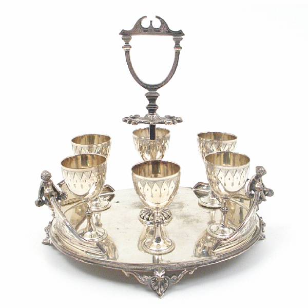 Appraisal: A Victorian silverplate figural egg cruet fitted with six cupsMappin