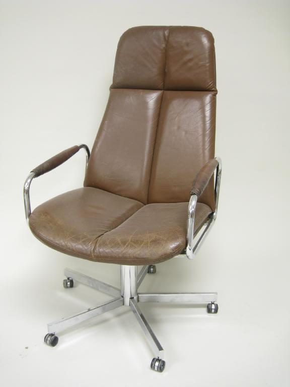 Appraisal: A Pieff Norwegian swivel Chair brown leather upholstery with chromed